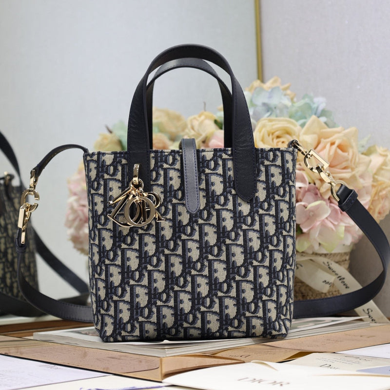 Small-sized Toujours Vertical Handbag Blue D Fabric